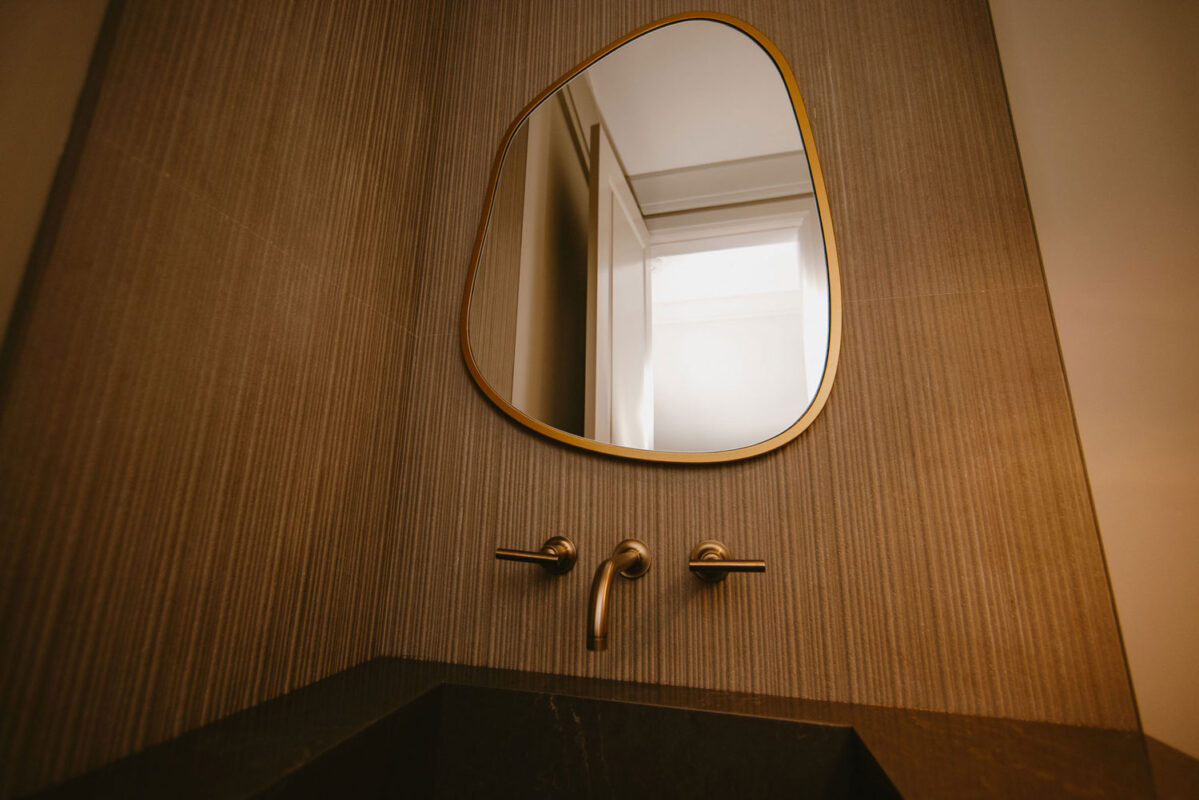 Renovated Washroom with gold Accents